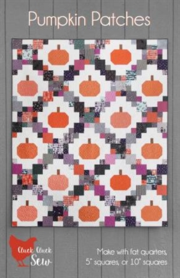 Pumpkin Patches Quilt Pattern by Cluck Cluck Sew features pumpkins set in a lattice of pieced rectangles and squares.