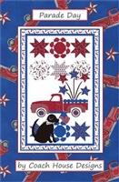 PARADE DAY QUILT PATTERN BY COACH DESIGNS DEPICTS A 4TH OF JULY PARADE WITH FIREWORKS, A FIRE TRUCK AND A BLACK LABRADOR RETIREVER