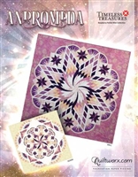 Andromeda Quilt Pattern by Judy Niemeyer shows are large 8 pointed star design with a central swirling motif.