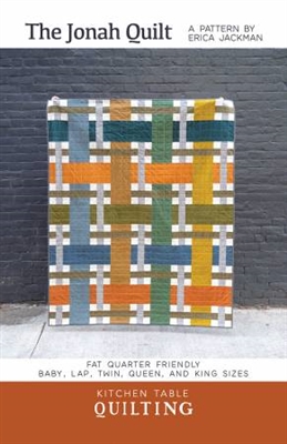 The Jonah Quilt Pattern by Kitchen Table Quilting shows a quilt that looks like the fabrics are woven over and under each other in a very modern, masculine design.