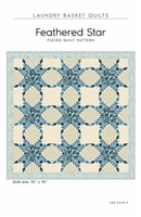 Feathered Star Quilt Pattern by Laundry Basket Quilts shows feathered stars in shades of blue.
