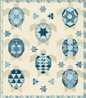 The Turtles Quilt Pattern by Laundry Basket Quilts design features a large group of sea turtles swimming in a huddle with all the fabrics being from the Blue Escape Collection.
