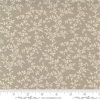 This fabric features a tiny cream vine outline with leaves on a taupe ground