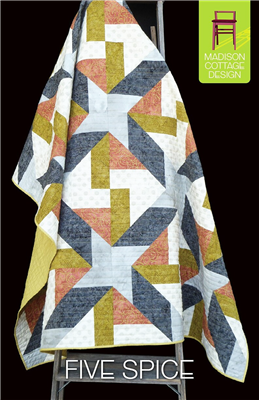 This quilt has very large graphic blocks with a twisted star motif.