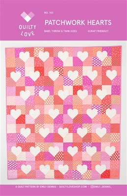 This scrappy quilt features white hearts on various shades of pink background squares.