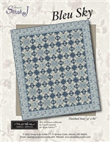 This quilt pattern features two alernating quilt blocks all in blues.