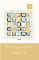 Alphabet Log Cabin Quilt Pattern by Stacy Iest Hsu shows the star quilt with Alphabet blocks in the center of each star, from A to Z with an animal depicted in each one.