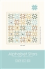Alphabet Stars Quilt Pattern by Stacy Iest Hsu shows the star quilt with Alphabet blocks in the center of each star, from A to Z with an animal depicted in each one.
